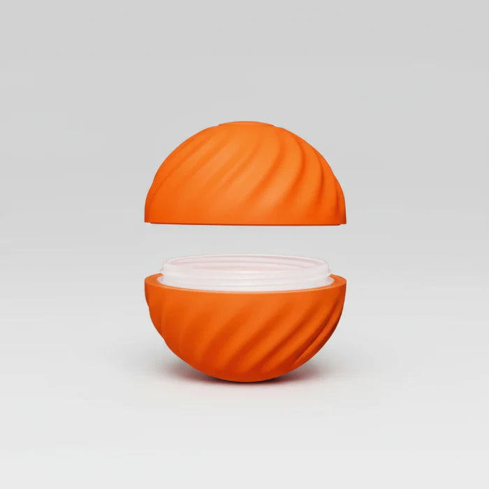 Balle interactive pour chien orange avec texture rainurée et compartiment ouvert pour friandises