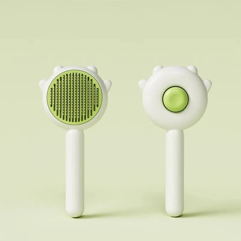 Brosse poils chat Oscar et Plume blanche avec poils verts et ergonomique pour un toilettage facile