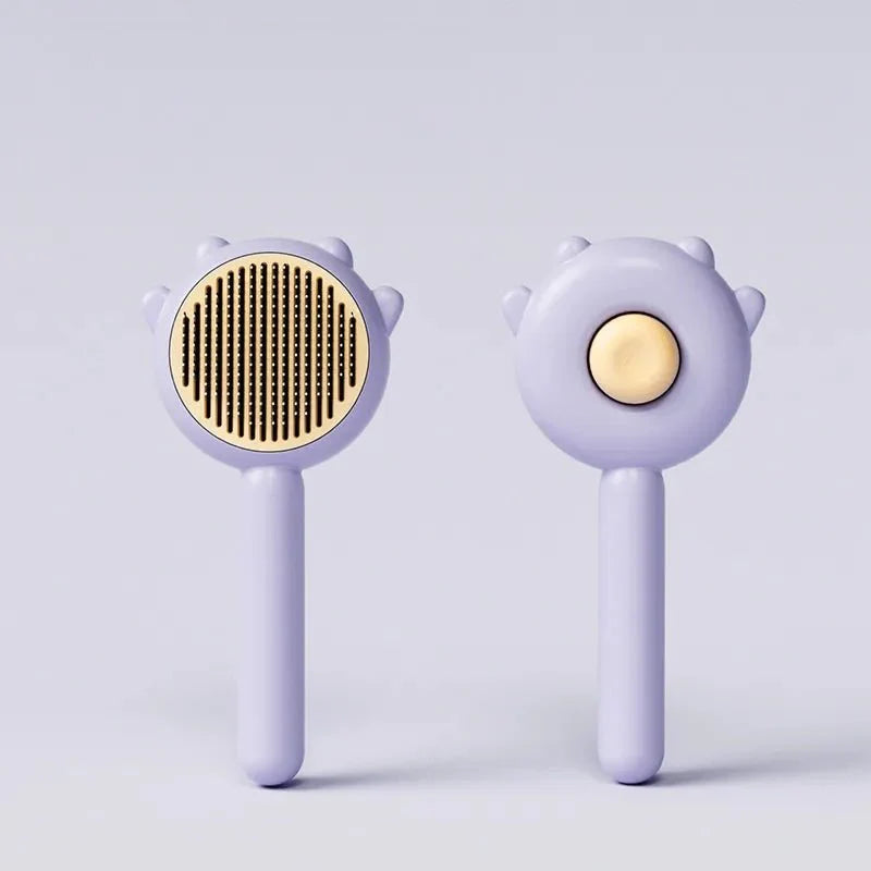 Brosse poils chat Oscar et Plume en plastique violet avec picots dorés pour démêler et entretenir le pelage