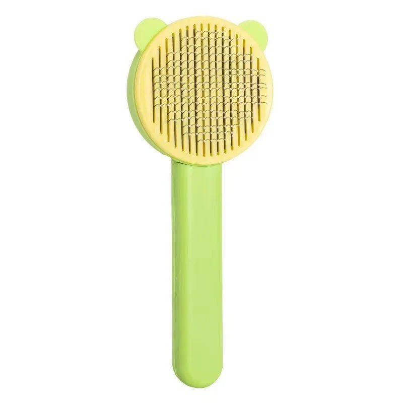 Brosse poils chat couleur vert et jaune avec picots métalliques pour le toilettage des chats