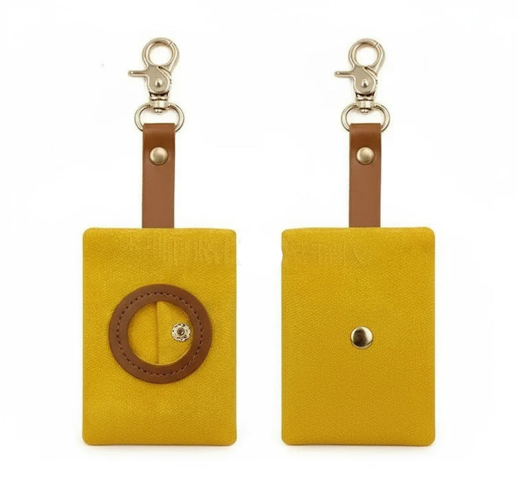 Distributeur de sac à déjections pour chien en tissu jaune avec attache métal par Oscar et Plume