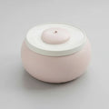 Fontaine à eau pour chat design ronde en rose pastel avec eau filtrée en circulation