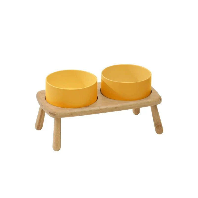 Gamelle céramique chien jaune avec support en bois sur pieds pour repas confortable