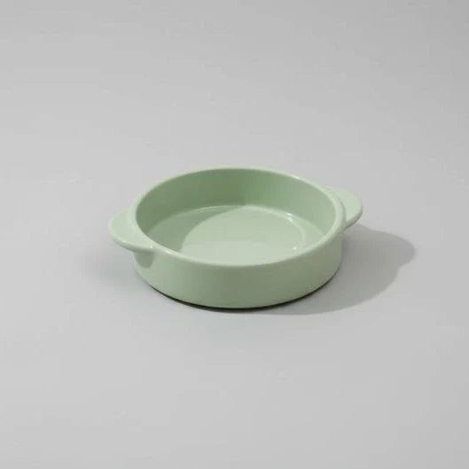 Gamelle design chien vert pastel de la marque Oscar et Plume pour un repas élégant
