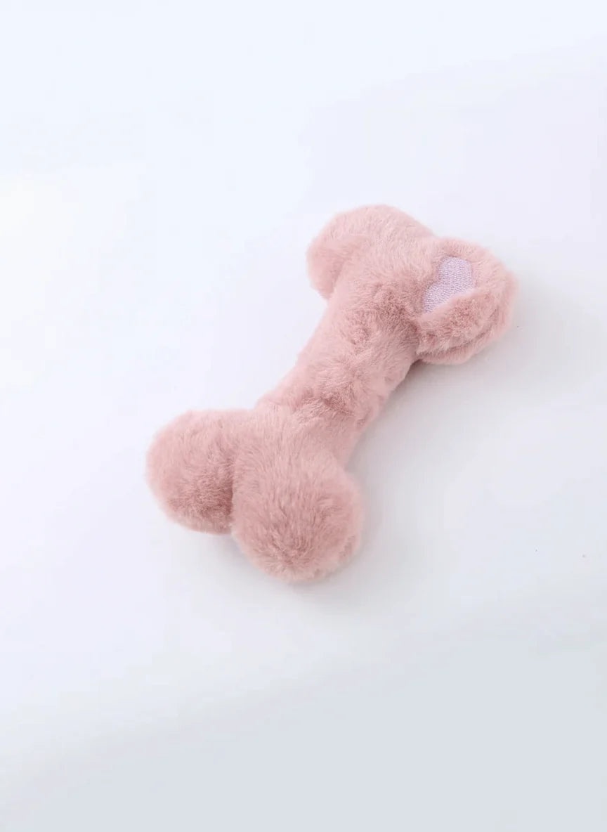 Jouet os en peluche pour chien de couleur rose, doux et de taille idéale pour le jeu