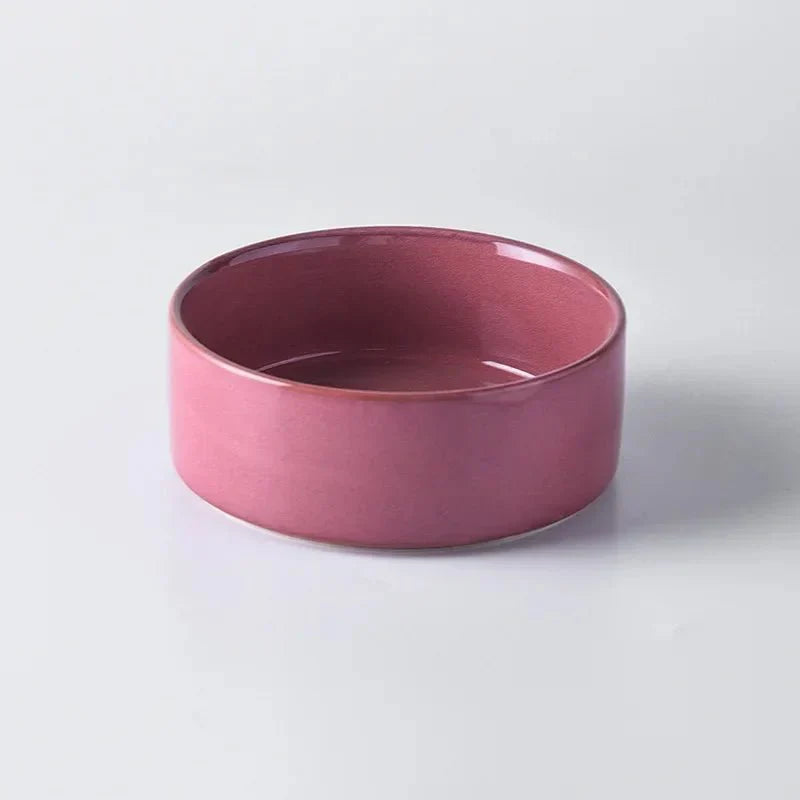 Gamelle en céramique rose pour chien, design élégant, capacité 850 ml, support bois.