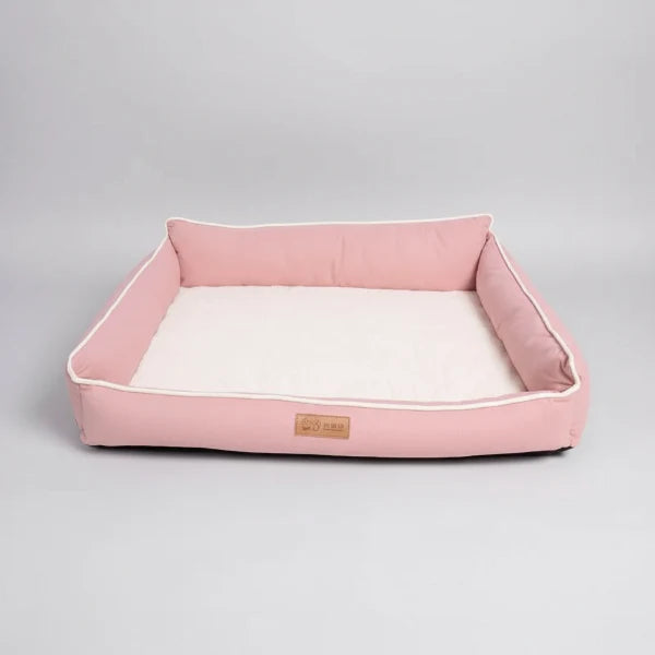 Panier chien confortable rose avec rebords surélevés pour un soutien optimal et douceur intérieure