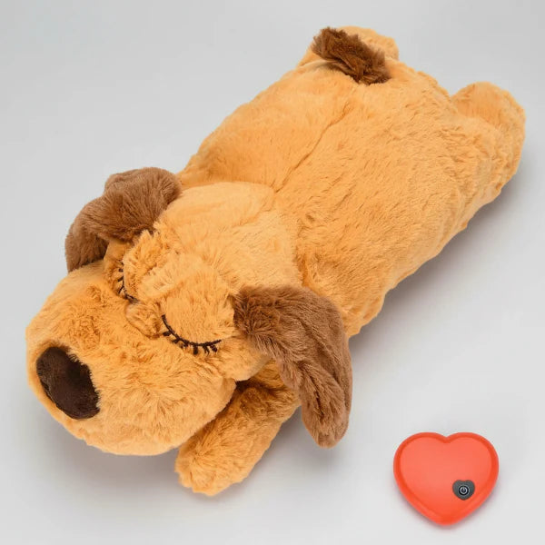 Peluche apaisante pour chien en forme de chien avec des yeux fermés et un doux pelage en orange