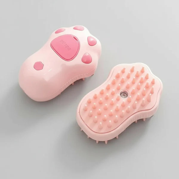 Brosse vapeur chien chat rose en forme de patte avec picots pour démêler et nettoyer le pelage