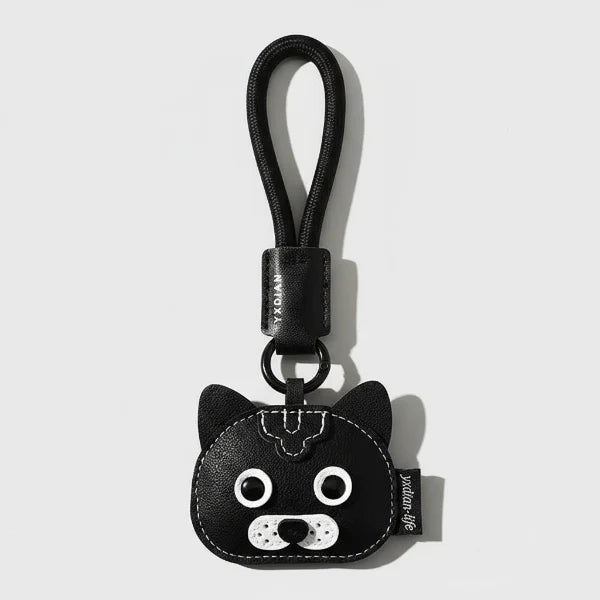 Porte-clés chien en cuir noir avec tête de chien stylisée et boucle pour attacher aux clés