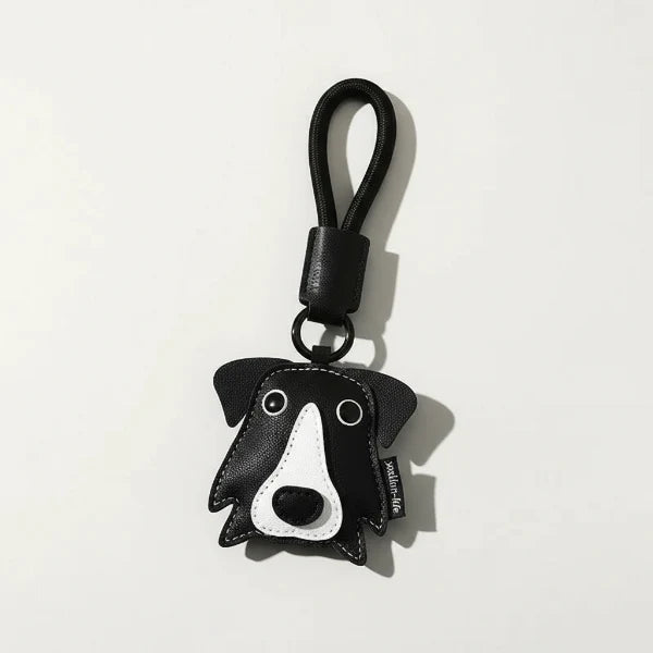 Porte-clés chien en cuir noir et blanc avec boucle en corde noir de Oscar et Plume