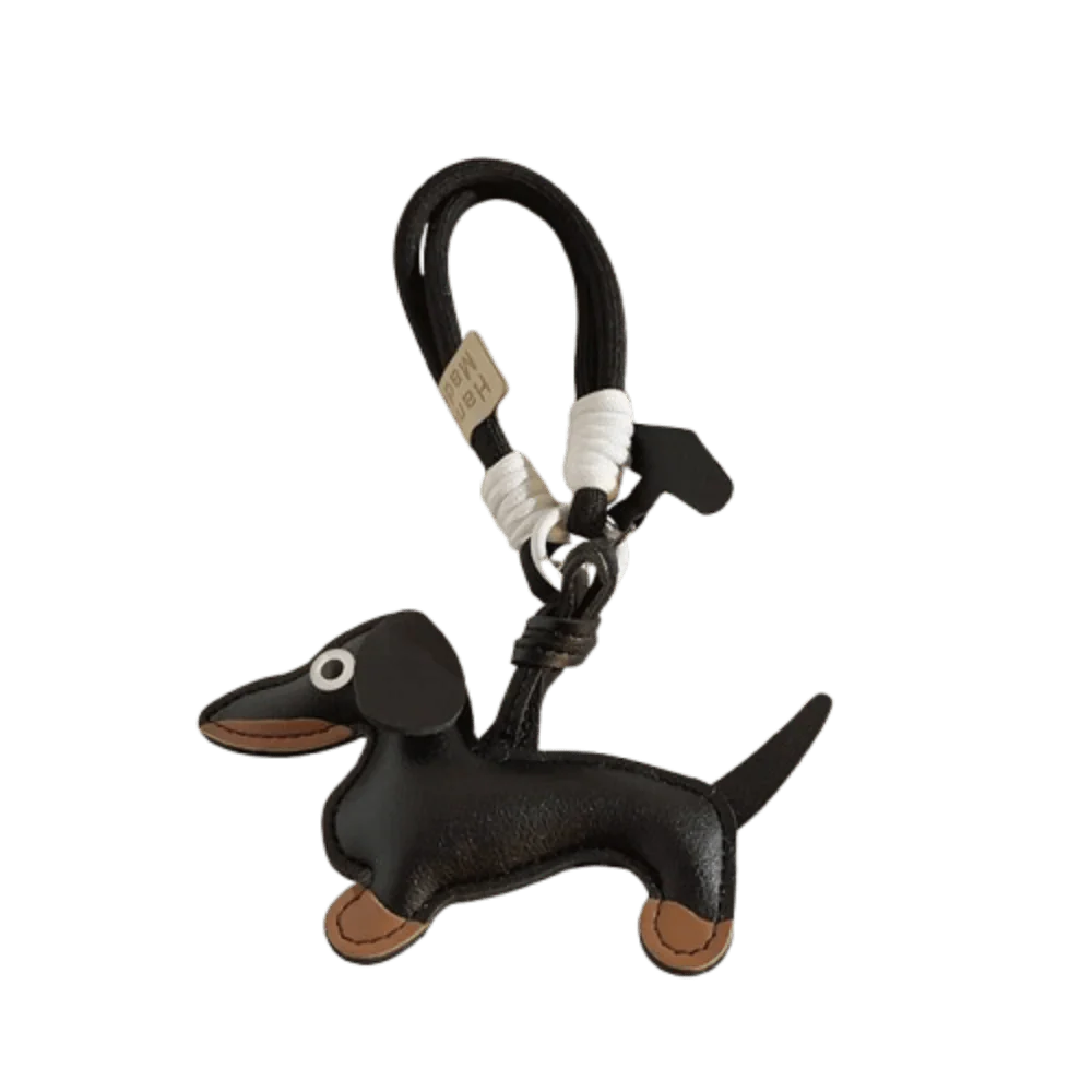Porte-clés original teckel en cuir noir avec détails marron et œil blanc signé Oscar et Plume