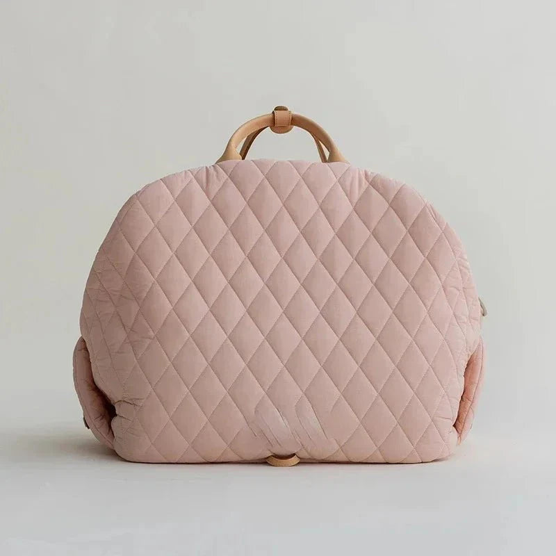 Sac de transport pour chien rose matelassé avec une poignée élégante pour voyager confortablement