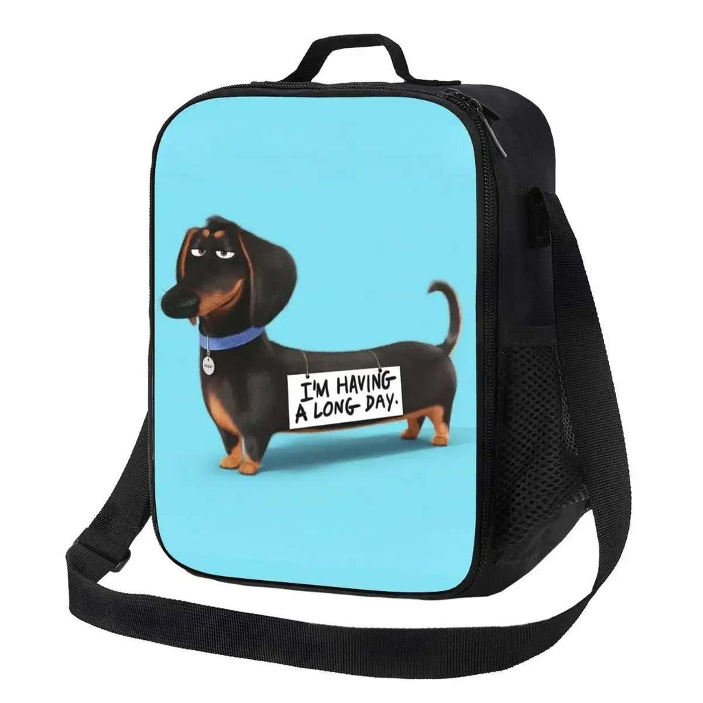 Sac isotherme design chien avec illustration de teckel noir sur fond bleu par Oscar et Plume