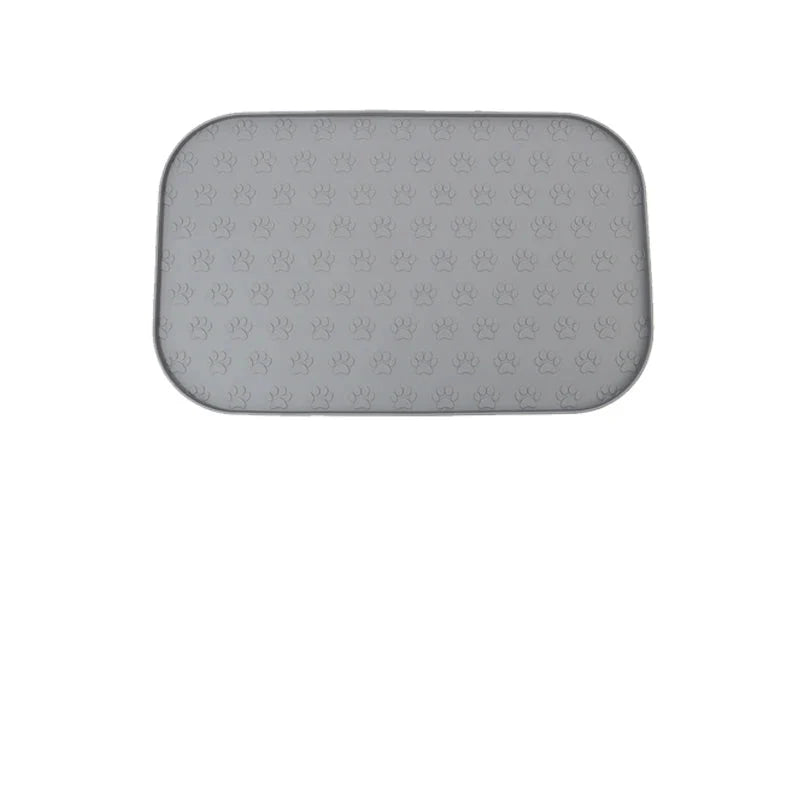 Tapis en silicone pour gamelle chien avec motif de pattes antidérapant et surface facile à nettoyer