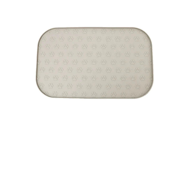 Tapis en silicone pour gamelle chien avec un motif de pattes antidérapant et facile à nettoyer